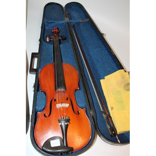 241 - Violin in fitted case, case inscribed made in the Peoples Republic of China and another with bow, bo... 