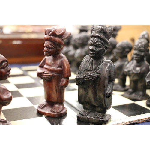 143 - Hand-made Nigerian chess set.