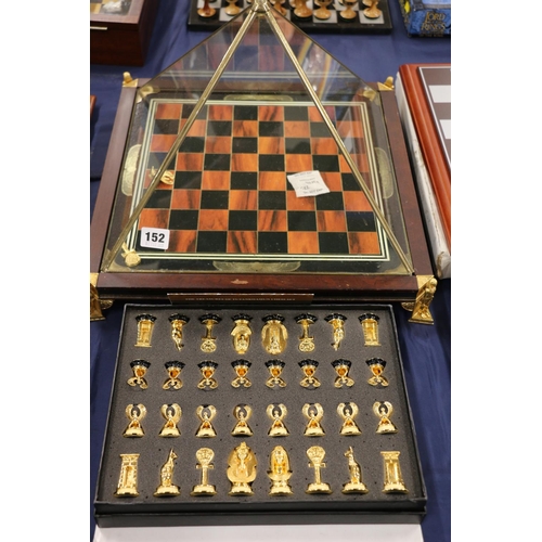 152 - The Treasures of Tutankhamen chess set, chessboard within a glazed pyramid.