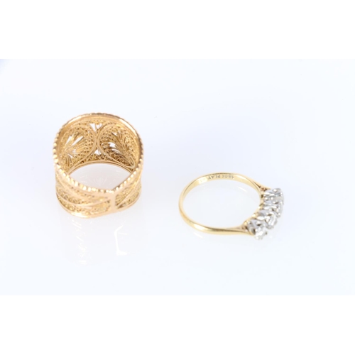 592 - Yellow metal ring with pierced foliate design, size Q and 4 stone gold plated ring size Q. 