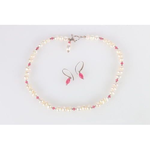 594 - String of freshwater pearls divided by pink stone beads, with silver clasp, 47cm, and matching earri... 