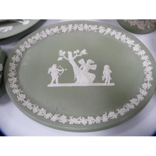 101 - Collection of Wedgwood green Jasper ware including boxes, dishes, vases, comport etc.