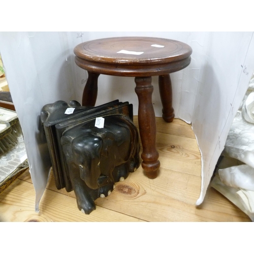 108 - Three-legged milking stool and a pair of ebony elephant bookends.