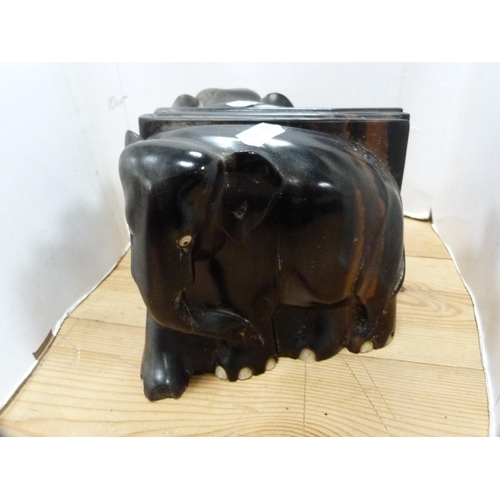 108 - Three-legged milking stool and a pair of ebony elephant bookends.