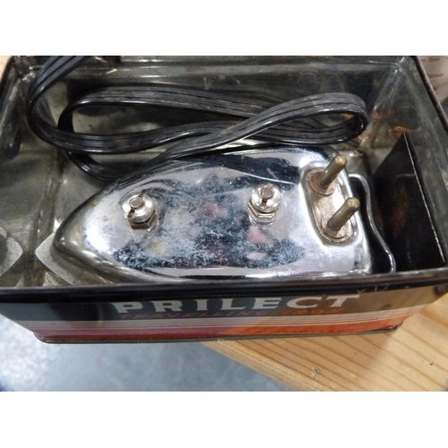 110 - Three-piece Picquot ware tea set, pair of brass candlesticks, travel iron etc.