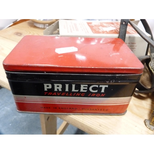 110 - Three-piece Picquot ware tea set, pair of brass candlesticks, travel iron etc.