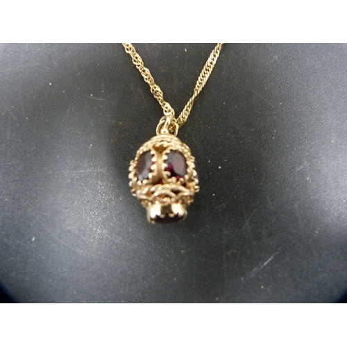 54 - 9ct gold chain with 9ct gold and garnet-style pendant, 10.4g gross.