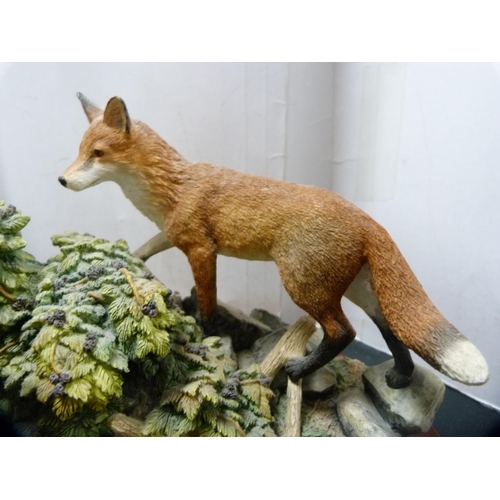 6 - Border Fine Arts group of two foxes on naturalistic base and fixed plinth.