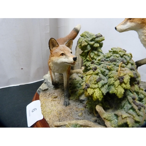 6 - Border Fine Arts group of two foxes on naturalistic base and fixed plinth.