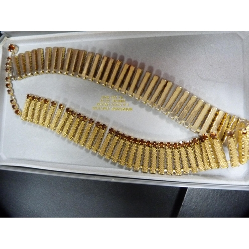 62 - Three small boxes containing costume and decorative jewellery to include pendants, rings, earrings, ... 