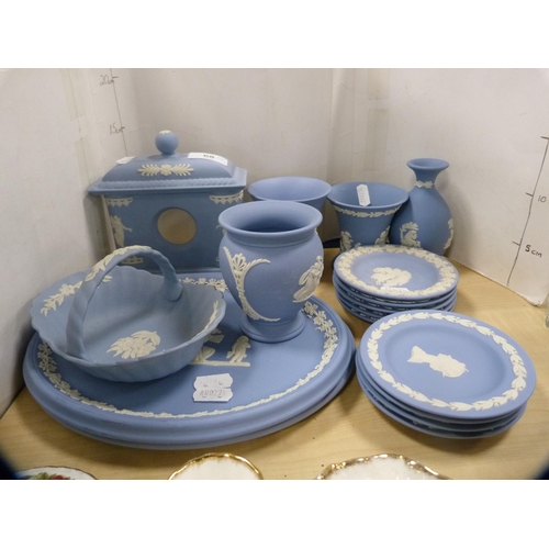 68 - Group of Wedgwood blue Jasper ware to include a clock case, oval plaques, spill vases, pin dishes et... 