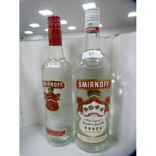 87 - Smirnoff Vodka, 70cl and 1 litre, Gordon's Gin, 1 litre, London Dry Gin, 70cl, and a half bottle of ... 