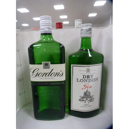 87 - Smirnoff Vodka, 70cl and 1 litre, Gordon's Gin, 1 litre, London Dry Gin, 70cl, and a half bottle of ... 