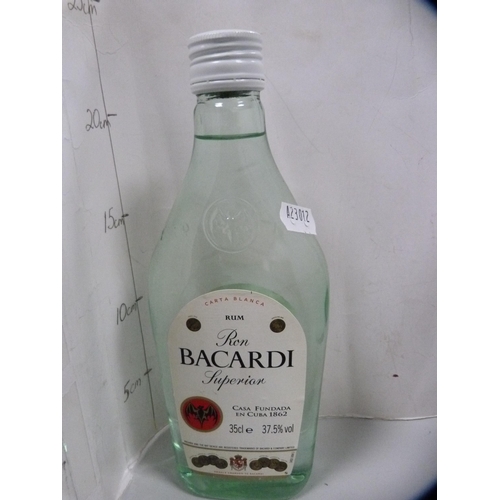 87 - Smirnoff Vodka, 70cl and 1 litre, Gordon's Gin, 1 litre, London Dry Gin, 70cl, and a half bottle of ... 