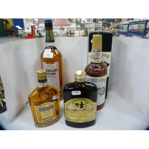 89 - Boxed bottle of Southern Comfort, 70cl, Morgan's Spiced Rum, 1 litre, a half bottle of Martell Fine ... 
