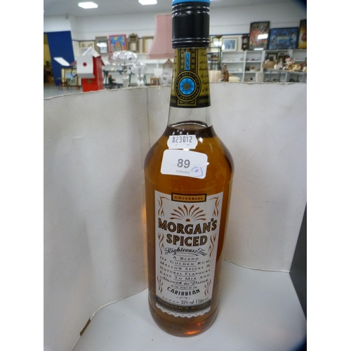 89 - Boxed bottle of Southern Comfort, 70cl, Morgan's Spiced Rum, 1 litre, a half bottle of Martell Fine ... 