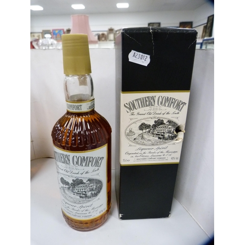 89 - Boxed bottle of Southern Comfort, 70cl, Morgan's Spiced Rum, 1 litre, a half bottle of Martell Fine ... 