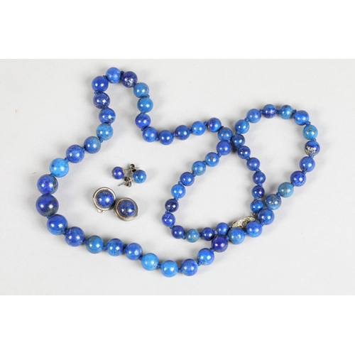 79 - Lapis lazuli bead necklace; together with two pairs of silver and lapis lazuli earrings