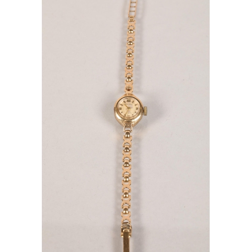 107 - Ladies 9 carat yellow gold cased and strap Rotary wristwatch; 10.4g gross weight