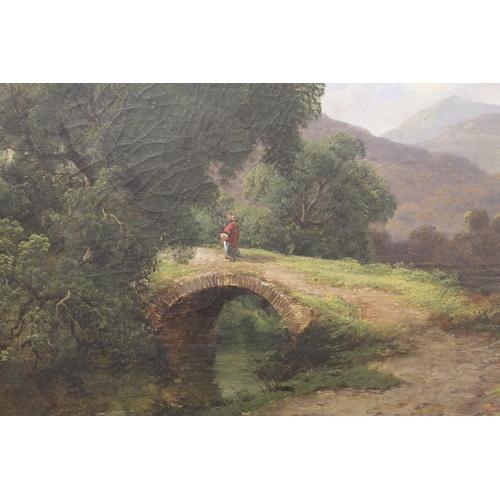 205 - 19th Century English School.A Lakeland landscape with figure crossing a packhorse bridge, possibly W... 