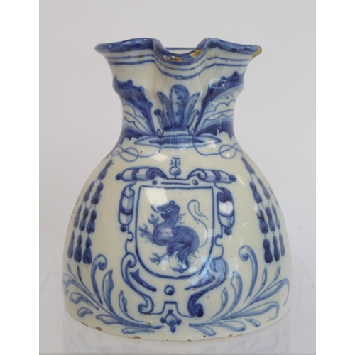 220 - Spanish Talavera de la Reina tin glazed blue and white jug of domed form with trefoil rim, decorated... 