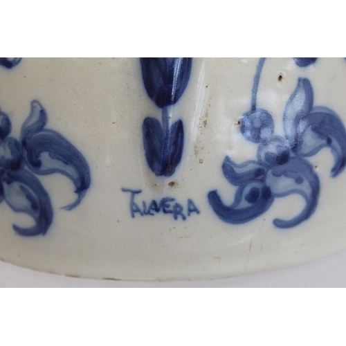 220 - Spanish Talavera de la Reina tin glazed blue and white jug of domed form with trefoil rim, decorated... 