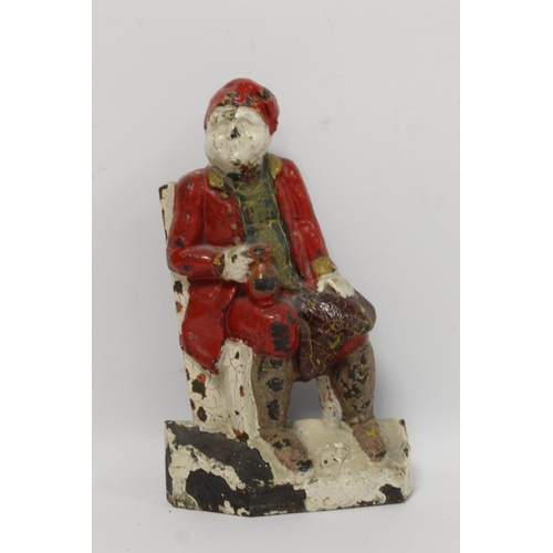 224 - Victorian polychrome painted cast iron doorstop in the form of a seated man with mug of ale, 24.5cm ... 