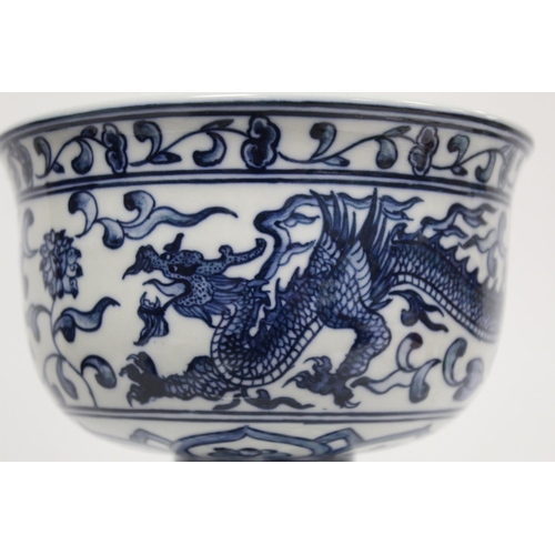 227 - 20th century Chinese blue and white stem cup decorated with a scrolling dragon amongst flowers and f... 