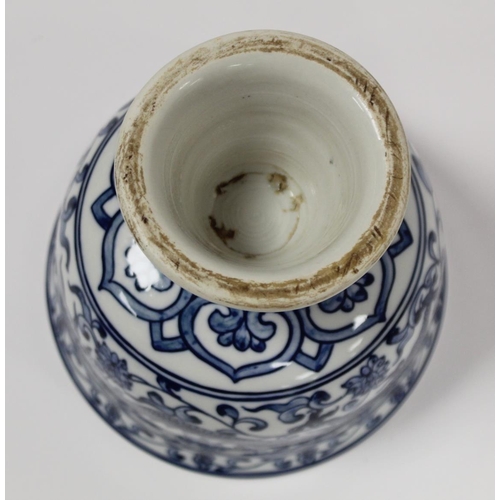 227 - 20th century Chinese blue and white stem cup decorated with a scrolling dragon amongst flowers and f... 