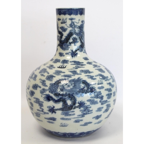 231 - Chinese Qing dynasty large blue and white bottle vase decorated with five five-clawed scrolling drag... 