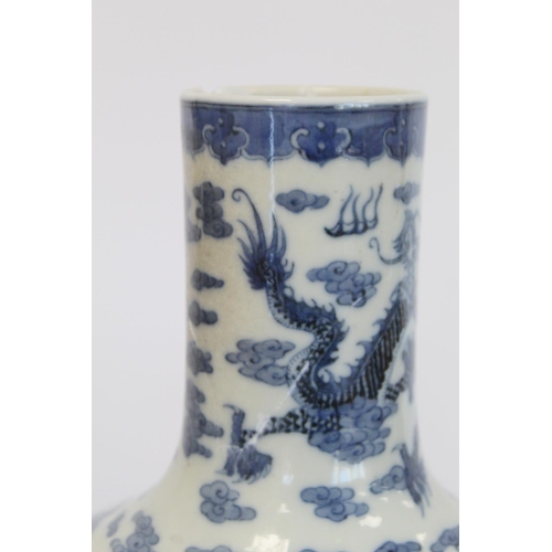 231 - Chinese Qing dynasty large blue and white bottle vase decorated with five five-clawed scrolling drag... 