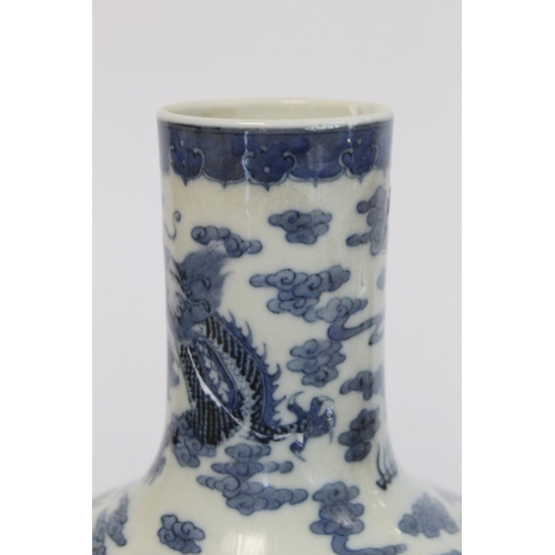 231 - Chinese Qing dynasty large blue and white bottle vase decorated with five five-clawed scrolling drag... 