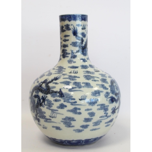 231 - Chinese Qing dynasty large blue and white bottle vase decorated with five five-clawed scrolling drag... 