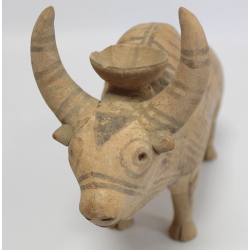 233 - Antique Eastern terracotta votive figure of a zebu (humped) bull with painted monochrome geometric d... 