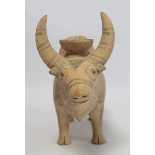 233 - Antique Eastern terracotta votive figure of a zebu (humped) bull with painted monochrome geometric d... 