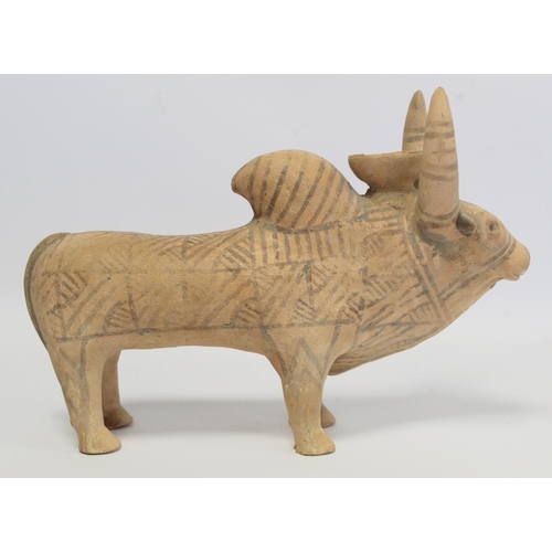 233 - Antique Eastern terracotta votive figure of a zebu (humped) bull with painted monochrome geometric d... 