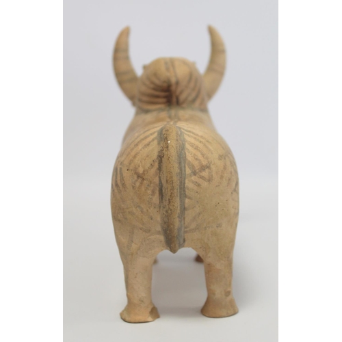 233 - Antique Eastern terracotta votive figure of a zebu (humped) bull with painted monochrome geometric d... 