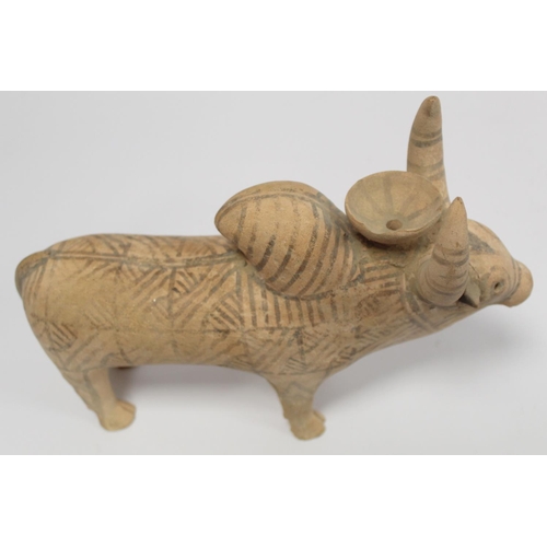 233 - Antique Eastern terracotta votive figure of a zebu (humped) bull with painted monochrome geometric d... 