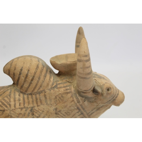 233 - Antique Eastern terracotta votive figure of a zebu (humped) bull with painted monochrome geometric d... 