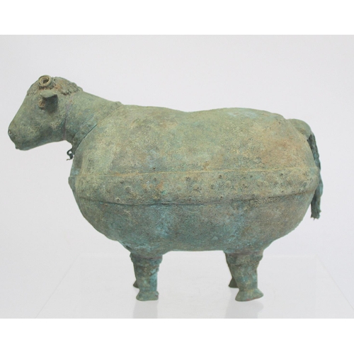 234 - Archaistic naive hollow bronze figure of a ram, the rotund body with rivet effect band and collar an... 