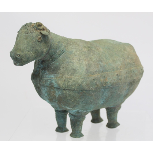 234 - Archaistic naive hollow bronze figure of a ram, the rotund body with rivet effect band and collar an... 