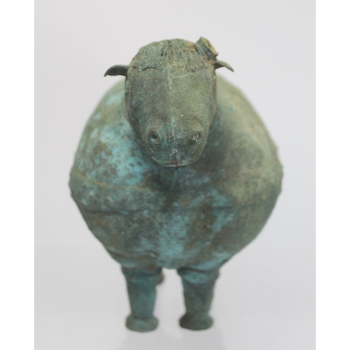 234 - Archaistic naive hollow bronze figure of a ram, the rotund body with rivet effect band and collar an... 