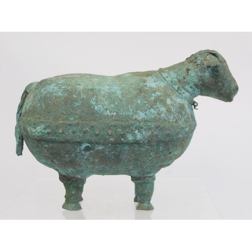 234 - Archaistic naive hollow bronze figure of a ram, the rotund body with rivet effect band and collar an... 