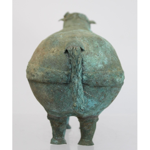 234 - Archaistic naive hollow bronze figure of a ram, the rotund body with rivet effect band and collar an... 