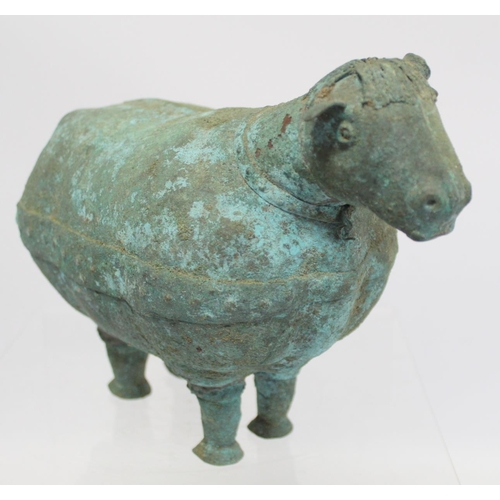 234 - Archaistic naive hollow bronze figure of a ram, the rotund body with rivet effect band and collar an... 