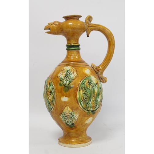 235 - Chinese sancai glazed pottery phoenix head ewer in the Tang dynasty style, the ovoid body with relie... 