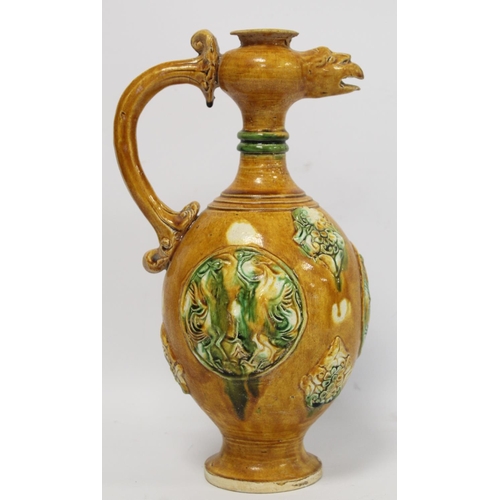 235 - Chinese sancai glazed pottery phoenix head ewer in the Tang dynasty style, the ovoid body with relie... 