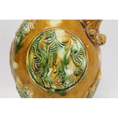 235 - Chinese sancai glazed pottery phoenix head ewer in the Tang dynasty style, the ovoid body with relie... 