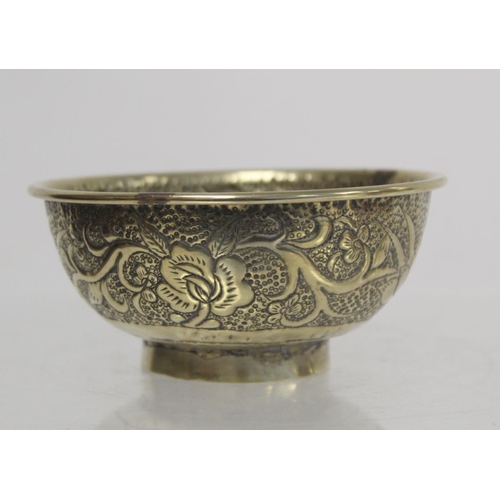 236 - Chinese small white metal bowl with repousse floral band to exterior and two punched character marks... 