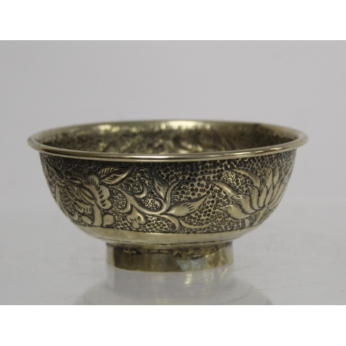 236 - Chinese small white metal bowl with repousse floral band to exterior and two punched character marks... 